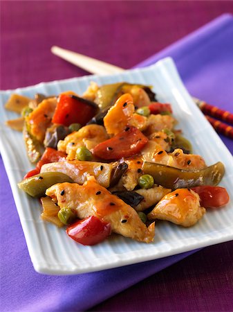Pekin chicken with peppers and black sesame seeds Stock Photo - Rights-Managed, Code: 825-06046141