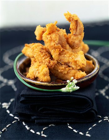 fried chicken - Marinated chicken fried in breadcrumbs and sesame seeds Stock Photo - Rights-Managed, Code: 825-06046668