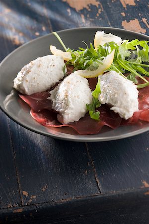quenelle - Goat's cheese quenelles on Bresaola Stock Photo - Rights-Managed, Code: 825-06046893