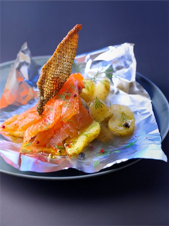 potato skins - Marinated salmon with crisp salmon skin,burning hot potatoes Stock Photo - Rights-Managed, Code: 825-06047221