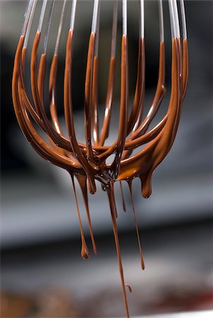 food photography chocolate pouring - Melted chocolate dripping from a whisk Stock Photo - Rights-Managed, Code: 825-06047437