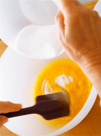 simsearch:825-07076761,k - Mixing together the egg yolks and the sugar Stock Photo - Rights-Managed, Code: 825-06047534