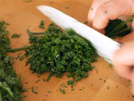 simsearch:825-07076592,k - Chopping the chives Stock Photo - Rights-Managed, Code: 825-06047544