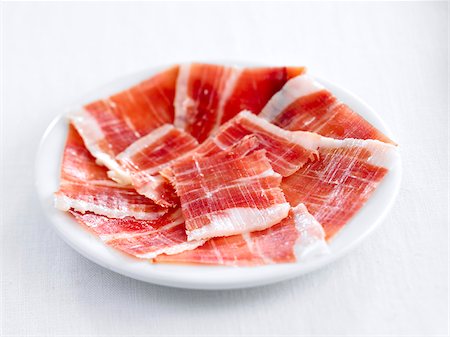 slice ham - Sliced Serrano ham Stock Photo - Rights-Managed, Code: 825-06047738