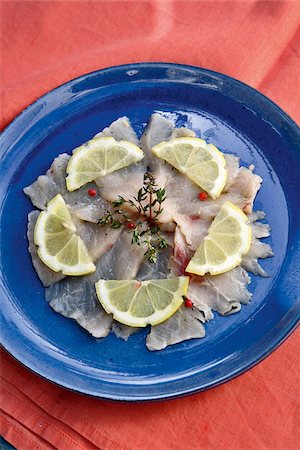 fish carpaccio - Swordfish Carpaccio with thyme and olive oil Foto de stock - Con derechos protegidos, Código: 825-06048123