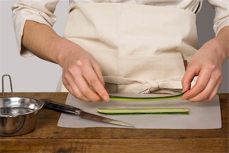 sign board japanese style - Cook preparing cucumber slices for the makis Stock Photo - Rights-Managed, Code: 825-06048725