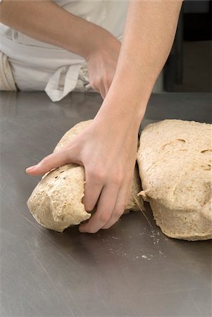 simsearch:652-07655763,k - Cook dividing a dough ball Stock Photo - Rights-Managed, Code: 825-06048743