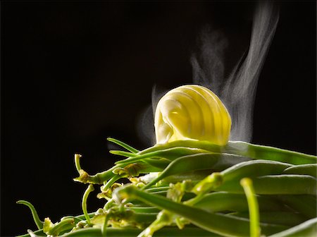 Curl of butter on green beans Stock Photo - Rights-Managed, Code: 825-06048781