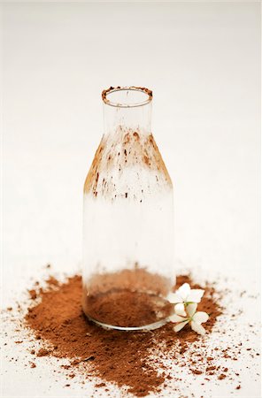 Empty bottle,cocoa and jasmin flower Stock Photo - Rights-Managed, Code: 825-06048929