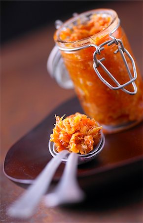 Jar and spoonful of pumpkin and chestnut chutney Fotografie stock - Rights-Managed, Codice: 825-06049351