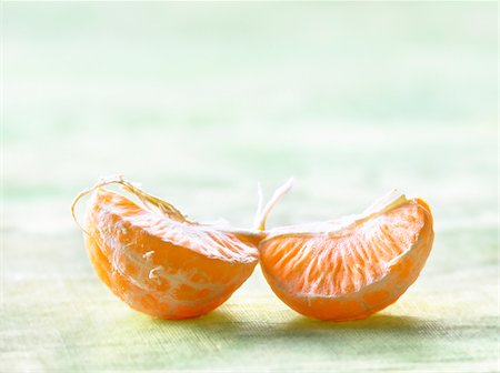 Clementine segments Fotografie stock - Rights-Managed, Codice: 825-06315115