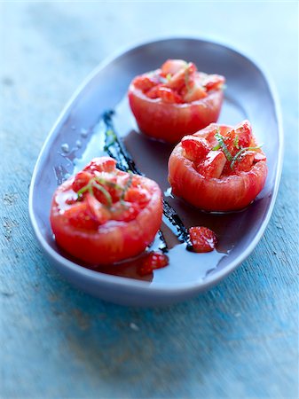 simsearch:652-05808065,k - Peeled tomatoes stuffed with strawberries,lime juice and vanilla Foto de stock - Con derechos protegidos, Código: 825-06315259