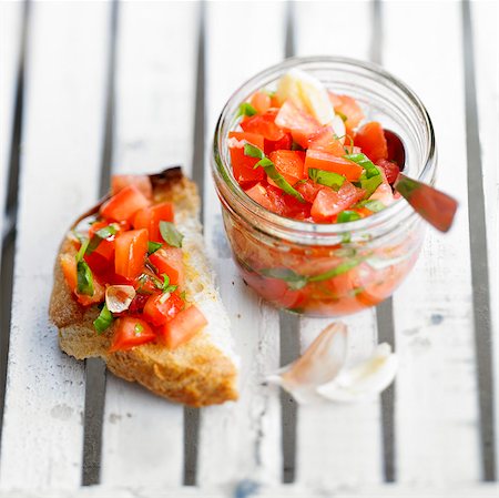 simsearch:652-05807417,k - Tomato,garlic,basil and olive oil Bruschetta Stock Photo - Rights-Managed, Code: 825-06315637