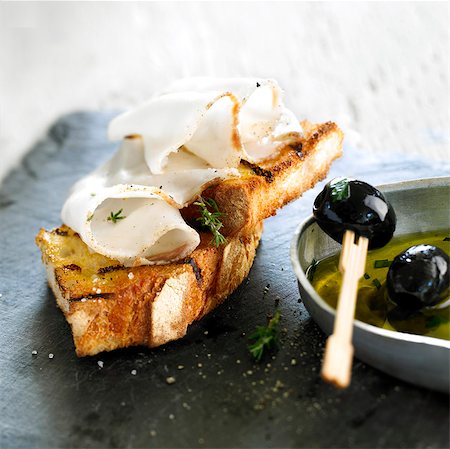 Colonnata fat and black olive Bruschetta Stock Photo - Rights-Managed, Code: 825-06315632