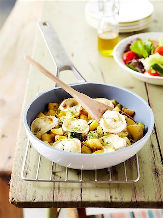 pan fried - Pan-fried zucchinis and potatoes with goat's cheese Stock Photo - Rights-Managed, Code: 825-06315654