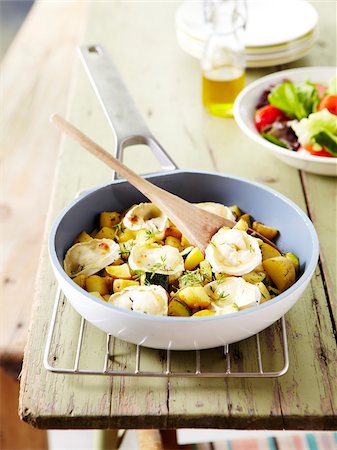 Pan-fried zucchinis and potatoes with goat's cheese Stock Photo - Rights-Managed, Code: 825-06315654