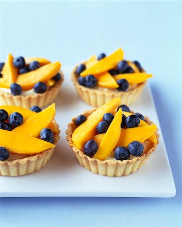 Mango and blueberry tartlets Stock Photo - Rights-Managed, Code: 825-06315884