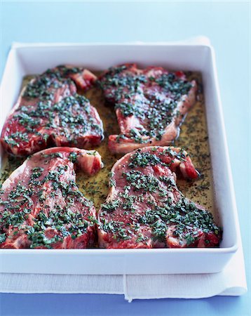 simsearch:652-05809138,k - Raw sliced leg of lamb marinating with herbs Stock Photo - Rights-Managed, Code: 825-06315902