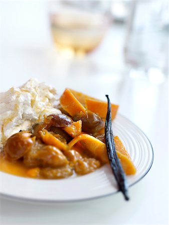 desserts with fruit sauces - Stewed mirabelle plums with cinnamon-flavored whipped cream Stock Photo - Rights-Managed, Code: 825-06315995