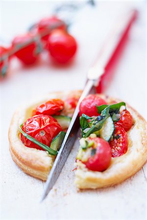 Cherry tomato,rocket and zucchini tartlet Stock Photo - Rights-Managed, Code: 825-06316148