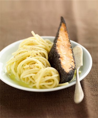 simsearch:652-05806903,k - Piece of salmon in poppyseed crust and spaghettis with coriander juice Stock Photo - Rights-Managed, Code: 825-06316252