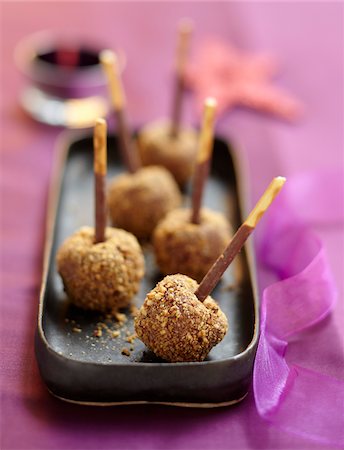 Chocolate and crushed hazelnut lollipops Stock Photo - Rights-Managed, Code: 825-06316369