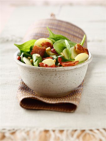 simsearch:825-07078203,k - Potato,cheese,baby spinach leaf and pine nut salad with cider vinegar salad Stock Photo - Rights-Managed, Code: 825-06316676