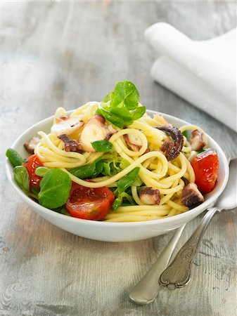 Spaghetti,octopus,corn salad and tomato salad Stock Photo - Rights-Managed, Code: 825-06316783