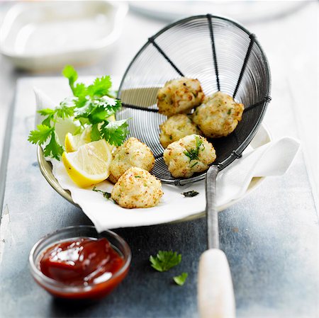 Fried bite-size pieces of fish with coconut Stock Photo - Rights-Managed, Code: 825-06316828