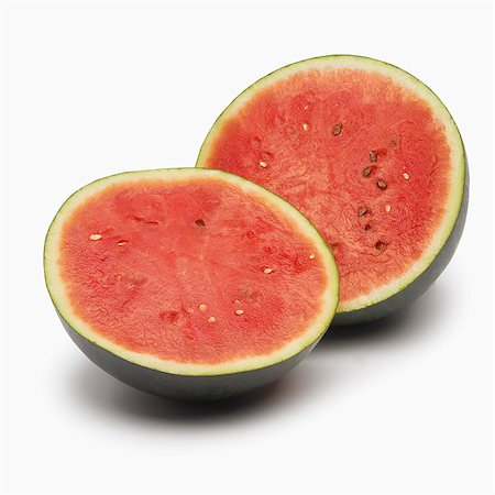 simsearch:825-07078253,k - Cut-out whole green watermelon cut in half Stock Photo - Rights-Managed, Code: 825-06815169