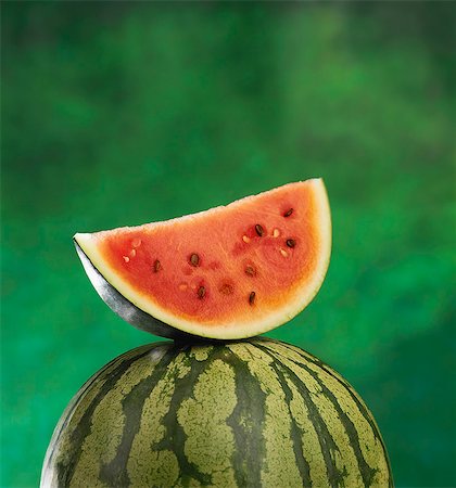 simsearch:825-06815166,k - Whole and a slice of watermelon Fotografie stock - Rights-Managed, Codice: 825-06815170