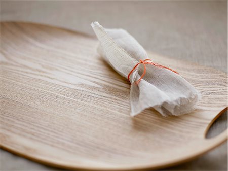 Piece of chiffon on a wooden tray Stock Photo - Rights-Managed, Code: 825-06815414