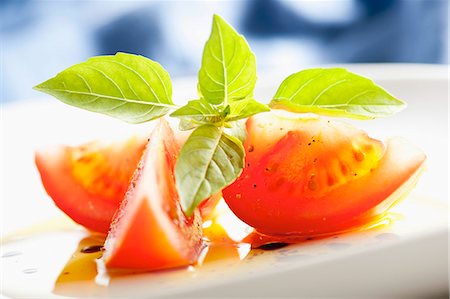 Sliced tomato with olive oil and basil Stock Photo - Rights-Managed, Code: 825-06815612