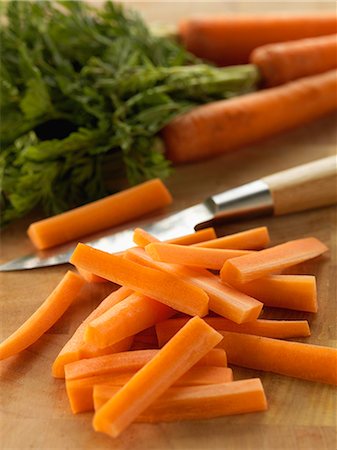 Cutting the carrots into short sticks Stock Photo - Rights-Managed, Code: 825-06816187