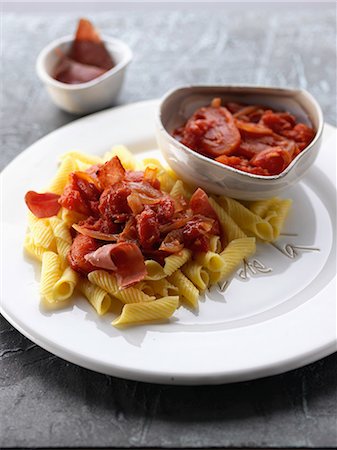 simsearch:652-06819349,k - Penne with red peppers and raw ham Stock Photo - Rights-Managed, Code: 825-06816298