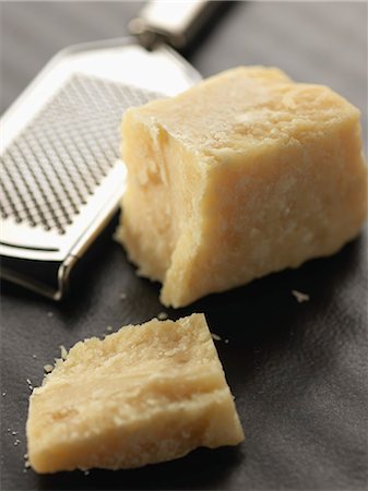 Piece of parmesan and grater Stock Photo - Rights-Managed, Code: 825-06816292