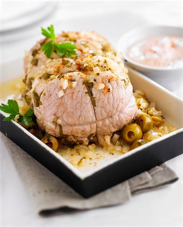 simsearch:825-05985340,k - Roast pork with olives,tomato and fromage frais sauce Stock Photo - Rights-Managed, Code: 825-06816609