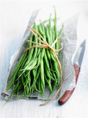 Bundle of green beans on newspaper Stock Photo - Rights-Managed, Code: 825-06816726