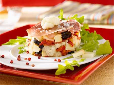 simsearch:825-03628682,k - Cauliflower,confit tomato, Beaufort,olive and raw ham Timbale Stock Photo - Rights-Managed, Code: 825-06817771