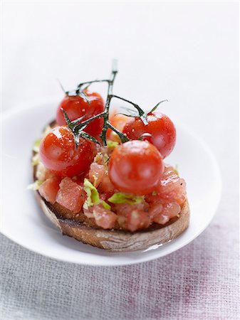 Crushed tomatoes,celery and cherry tomatoes on toast Stock Photo - Rights-Managed, Code: 825-06818167