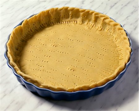 simsearch:652-05808734,k - Coating the mould with the pie doe Photographie de stock - Rights-Managed, Code: 825-07075812