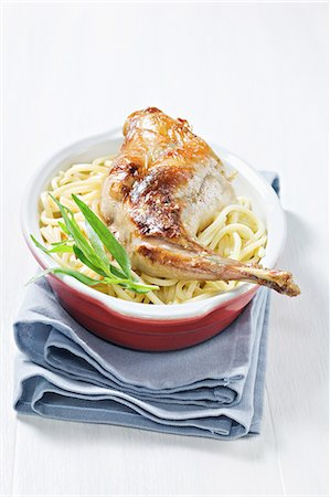 simsearch:652-05809339,k - Rabbit leg with tarragon on a bed of spaghetti Stock Photo - Rights-Managed, Code: 825-07076905