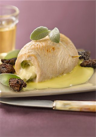 Rolled chicken breast stuffed with mozzarella and sage,sauteed morels and yellow wine sauce Stock Photo - Rights-Managed, Code: 825-07077024