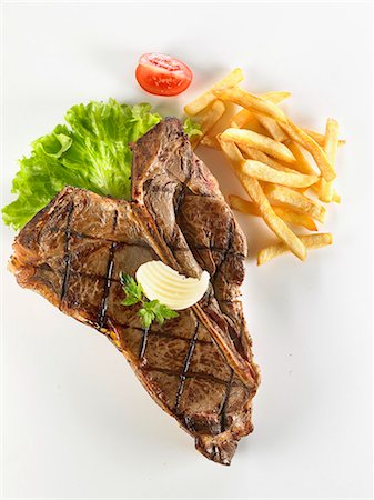 simsearch:825-02307332,k - Grilled T-bone steak and French fries Stockbilder - Lizenzpflichtiges, Bildnummer: 825-07077056