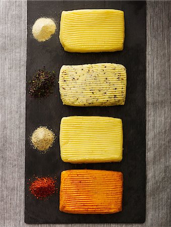 Different flavored slabs of butter Stock Photo - Rights-Managed, Code: 825-07077071