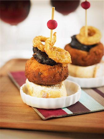 simsearch:825-07077705,k - Button mushroom,blood sausage and fried onion ring crostini Stock Photo - Rights-Managed, Code: 825-07077696