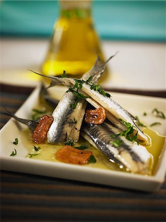 simsearch:652-07656387,k - Plate of anchovies with red pepper,garlic and parsley Foto de stock - Con derechos protegidos, Código: 825-07077699