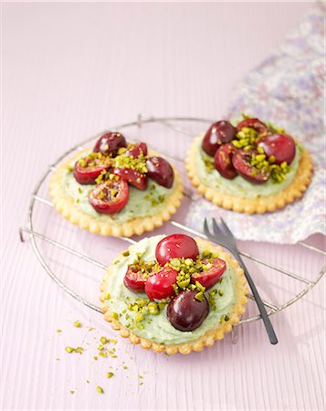 pistachio cream - Pistachio cream and cherry tarlets Stock Photo - Rights-Managed, Code: 825-07077809