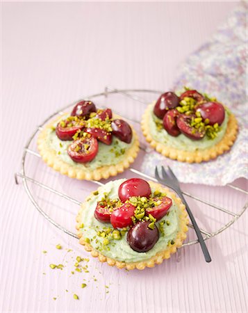 Pistachio cream and cherry tarlets Stock Photo - Rights-Managed, Code: 825-07077809