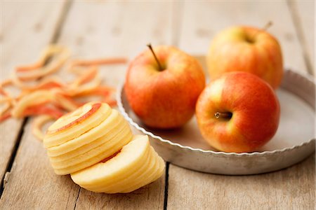 Peeling and slicing apples for a tart Stock Photo - Rights-Managed, Code: 825-07077920